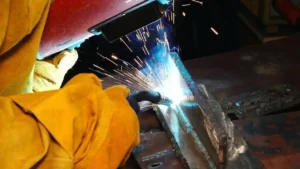 kales skilled welder on high strength steel structure